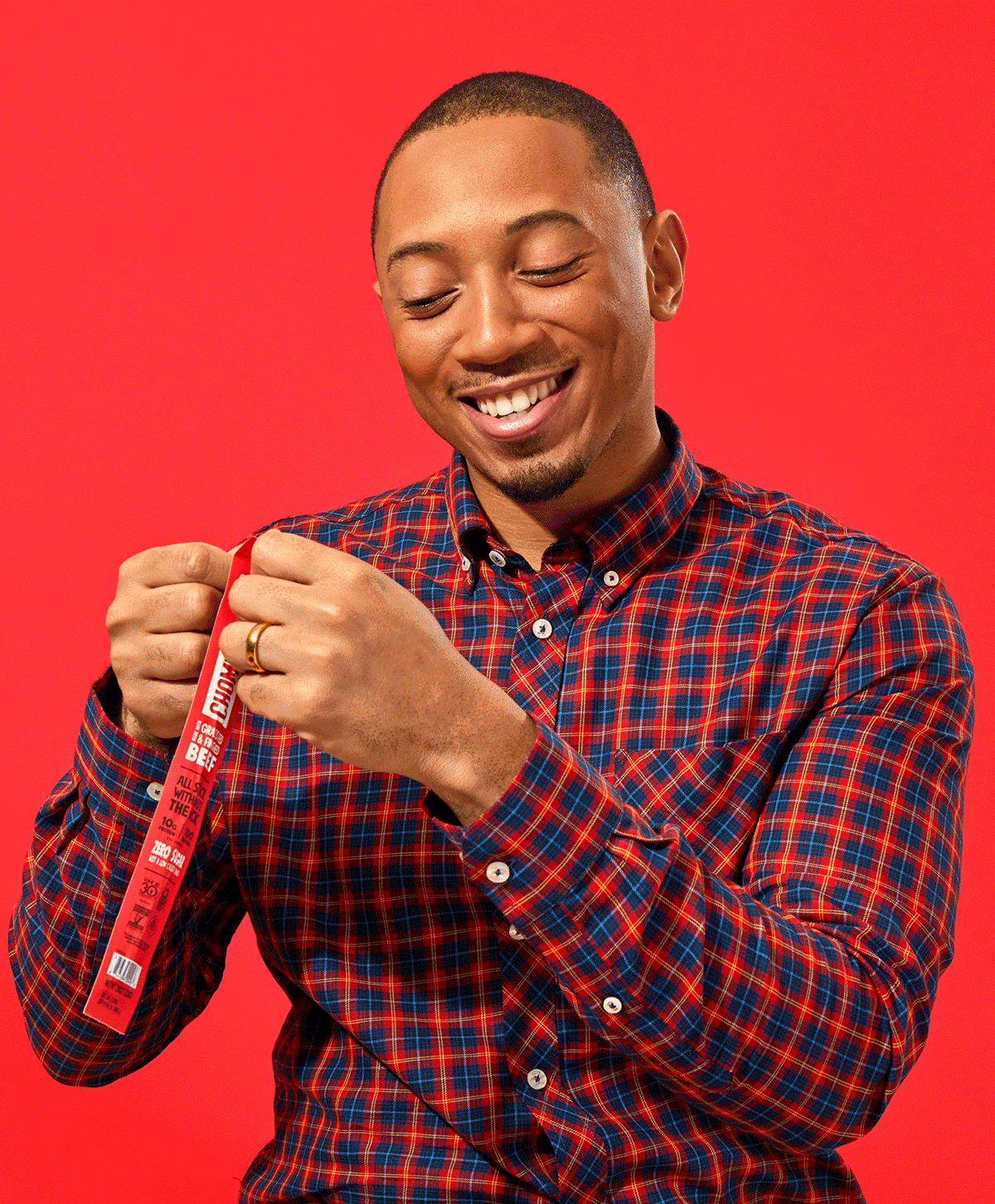 A stop motion image of a man opening an Original Beef Chomps