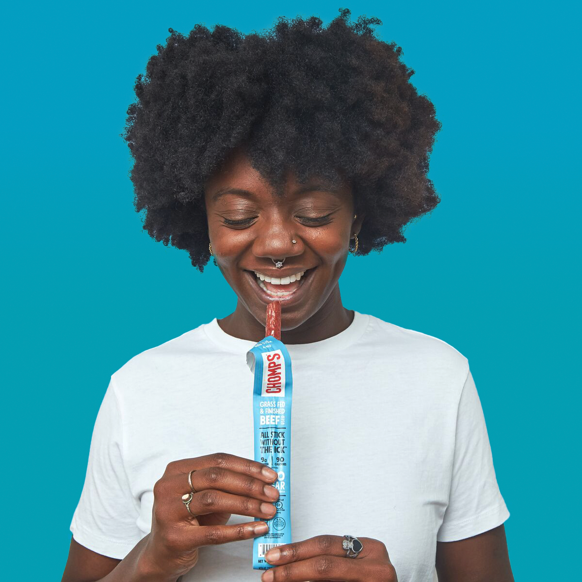 A woman eating a Sea Salt Beef Chomps